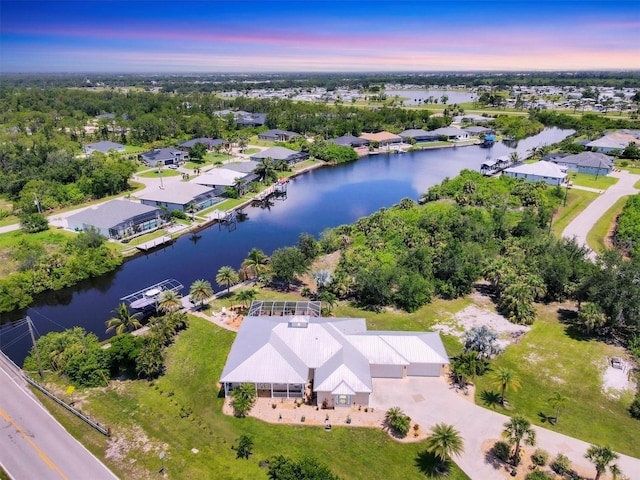 8127 Consul St, Port Charlotte, FL 33981 - aerial perspective of suburban area featuring a nearby body of water