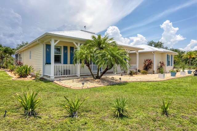 8127 Consul St, Port Charlotte, FL 33981 - view of front facade with a porch and a front yard