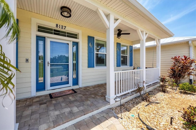 8127 Consul St, Port Charlotte, FL 33981 - view of exterior entry featuring covered porch and ceiling fan