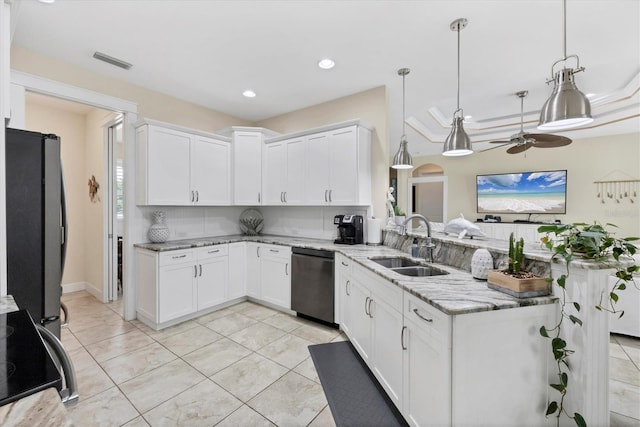 8127 Consul St, Port Charlotte, FL 33981 - kitchen featuring stainless steel dishwasher, freestanding refrigerator, range, a ceiling fan, and light stone counters