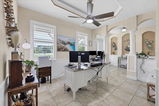 8127 Consul St, Port Charlotte, FL 33981 - home office featuring decorative columns, a ceiling fan, wainscoting, and arched walkways