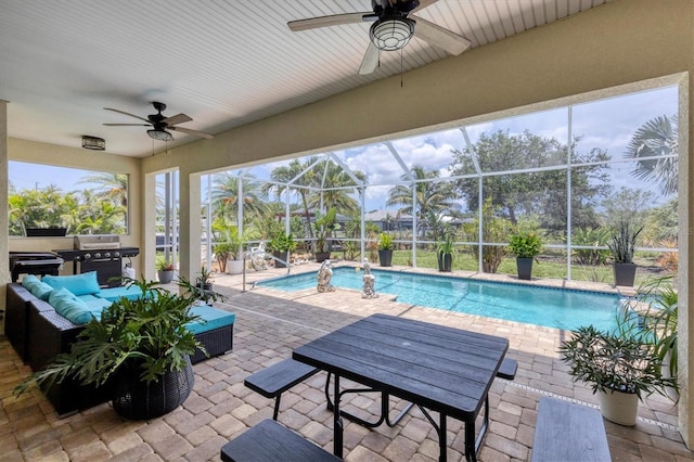 8127 Consul St, Port Charlotte, FL 33981 - swimming pool with a ceiling fan, an outdoor hangout area, area for grilling, a patio, and a lanai