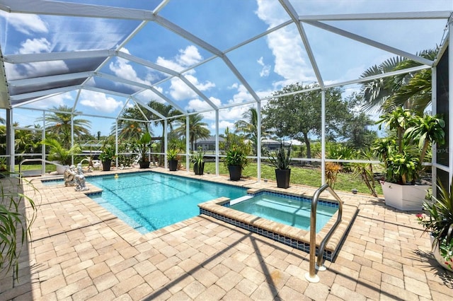 8127 Consul St, Port Charlotte, FL 33981 - view of pool featuring a pool with connected hot tub, a patio, and a lanai