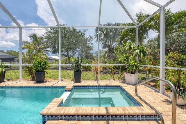 8127 Consul St, Port Charlotte, FL 33981 - view of swimming pool featuring glass enclosure, a patio area, and a pool with connected hot tub