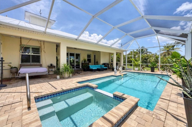8127 Consul St, Port Charlotte, FL 33981 - view of swimming pool featuring an outdoor hangout area, a patio area, a pool with connected hot tub, and a lanai