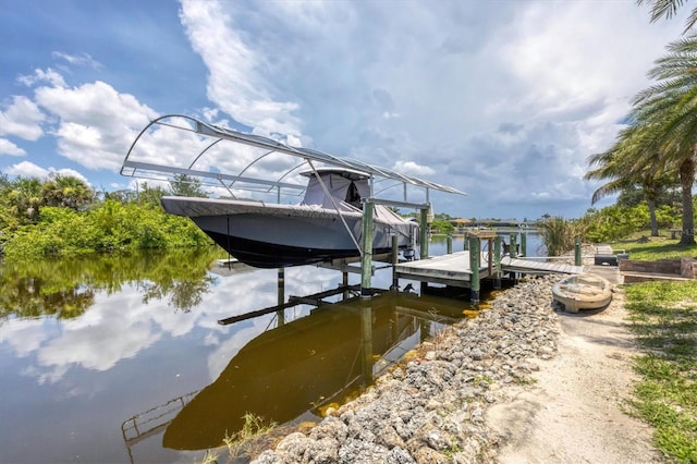 8127 Consul St, Port Charlotte, FL 33981 - dock featuring boat lift and a water view