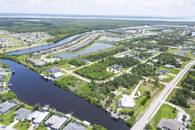 8127 Consul St, Port Charlotte, FL 33981 - aerial view of property and surrounding area featuring a nearby body of water and nearby suburban area
