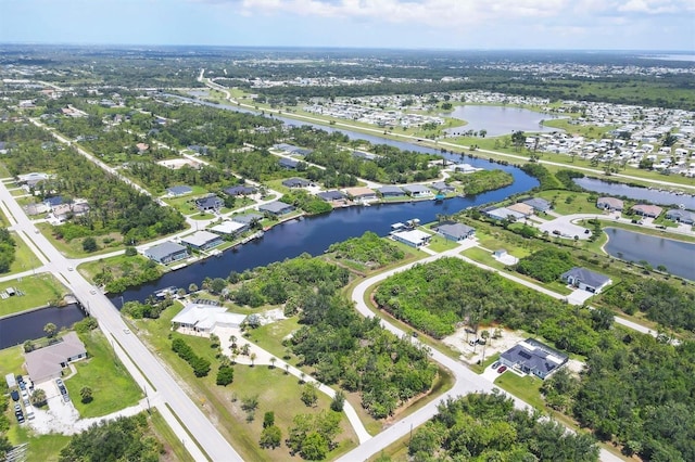 8127 Consul St, Port Charlotte, FL 33981 - aerial view of property and surrounding area featuring a large body of water and nearby suburban area