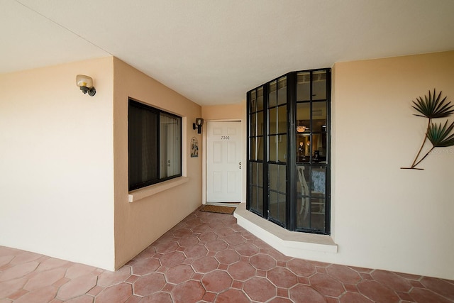 7303 Jessie Harbor Dr Unit 7303, Osprey, FL 34229 - view of exterior entry featuring stucco siding