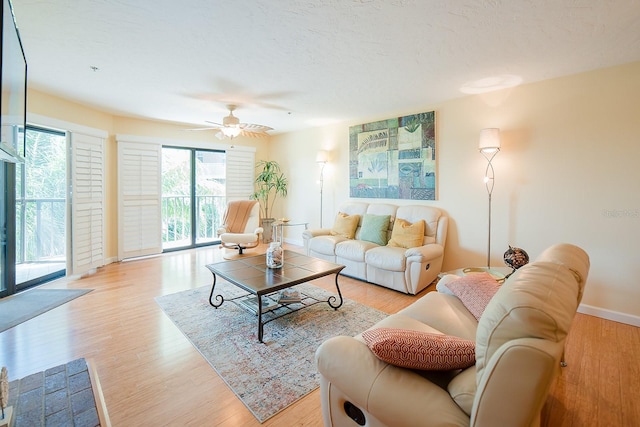 7303 Jessie Harbor Dr Unit 7303, Osprey, FL 34229 - living room with light wood-type flooring and ceiling fan
