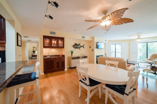 7303 Jessie Harbor Dr Unit 7303, Osprey, FL 34229 - dining room with light wood-style flooring and ceiling fan