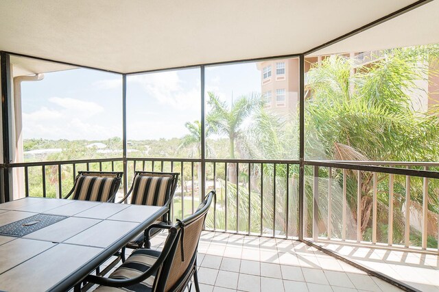7303 Jessie Harbor Dr Unit 7303, Osprey, FL 34229 - sunroom / solarium featuring healthy amount of natural light