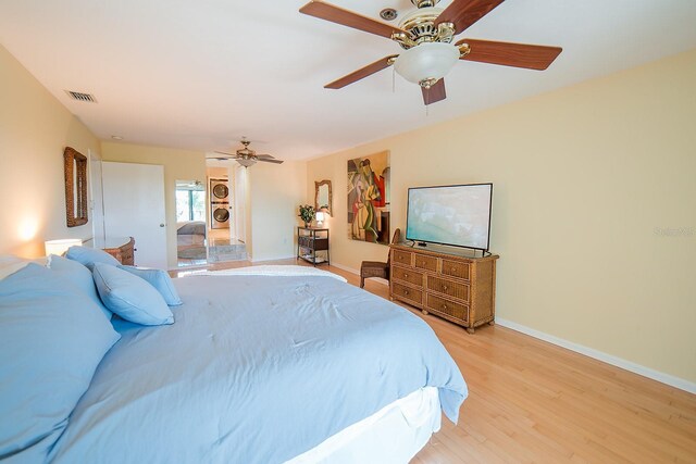 7303 Jessie Harbor Dr Unit 7303, Osprey, FL 34229 - bedroom with light wood-style floors and a ceiling fan