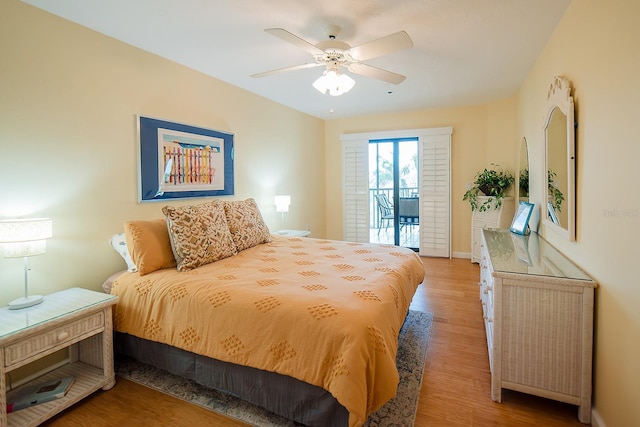 7303 Jessie Harbor Dr Unit 7303, Osprey, FL 34229 - bedroom with access to exterior, wood finished floors, and a ceiling fan