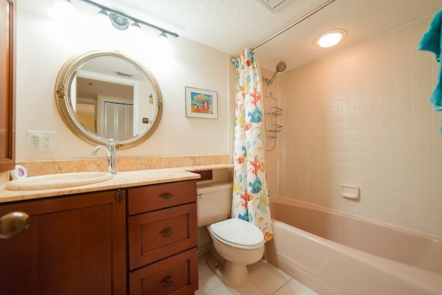 7303 Jessie Harbor Dr Unit 7303, Osprey, FL 34229 - bathroom featuring tile patterned flooring, vanity, shower / bath combination with curtain, and a textured ceiling