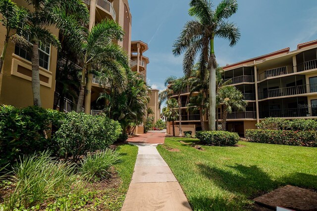 7303 Jessie Harbor Dr Unit 7303, Osprey, FL 34229 - view of property's community featuring a yard