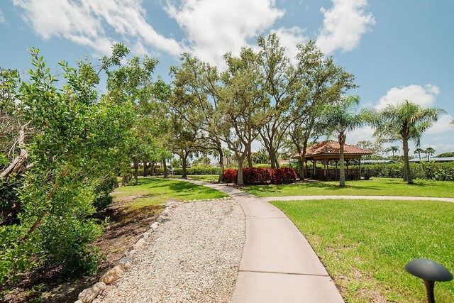 7303 Jessie Harbor Dr Unit 7303, Osprey, FL 34229 - surrounding community featuring a gazebo and a lawn