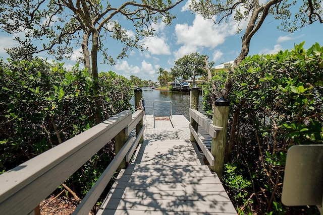 7303 Jessie Harbor Dr Unit 7303, Osprey, FL 34229 - dock featuring a water view