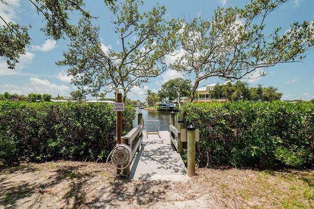7303 Jessie Harbor Dr Unit 7303, Osprey, FL 34229 - view of home's community featuring a boat dock and a water view