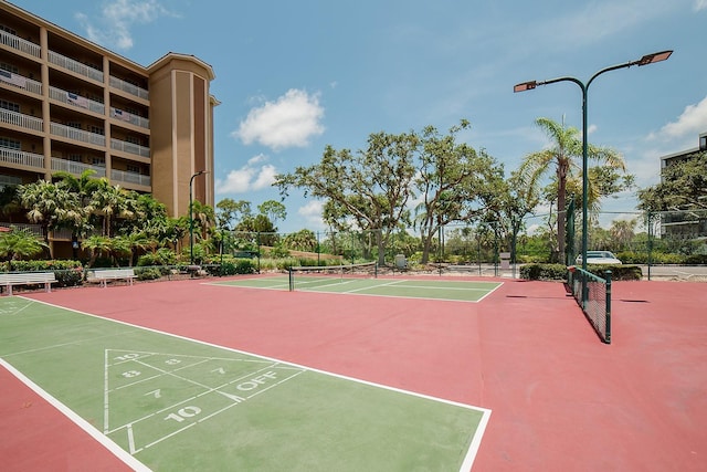 7303 Jessie Harbor Dr Unit 7303, Osprey, FL 34229 - view of community featuring a tennis court