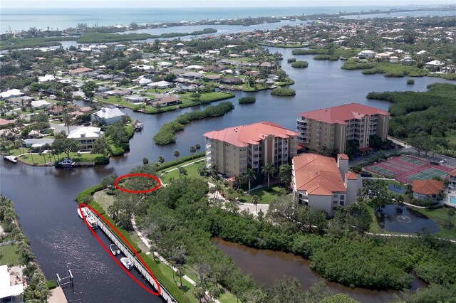 7303 Jessie Harbor Dr Unit 7303, Osprey, FL 34229 - drone / aerial view of a nearby body of water and apartment complex