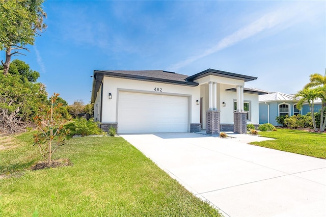 482 Sunset Rd N, Rotonda West, FL 33947 - view of front of house with stucco siding, an attached garage, driveway, and a front yard
