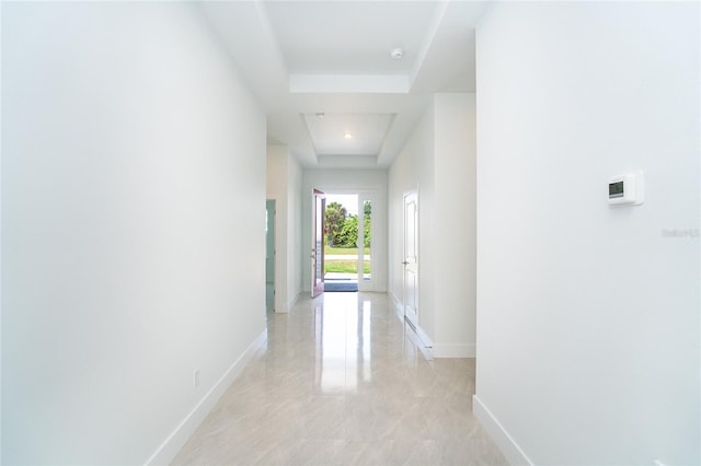 482 Sunset Rd N, Rotonda West, FL 33947 - hall with baseboards and a tray ceiling