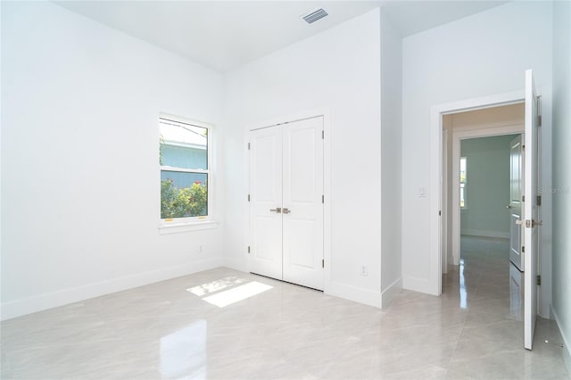 482 Sunset Rd N, Rotonda West, FL 33947 - unfurnished bedroom with baseboards and a closet