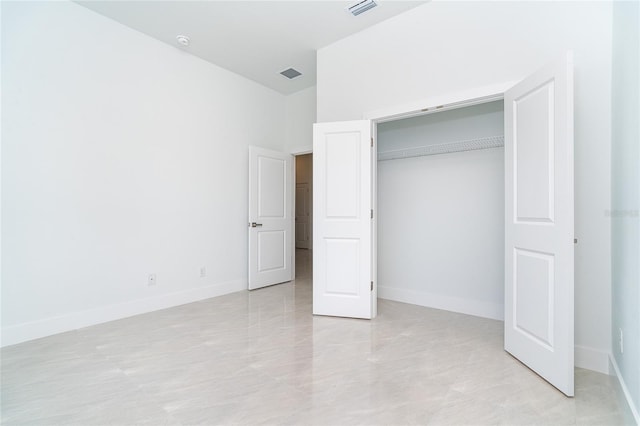 482 Sunset Rd N, Rotonda West, FL 33947 - unfurnished bedroom with a closet and baseboards