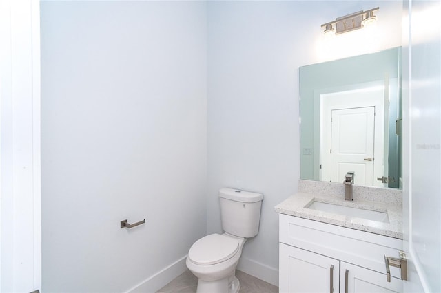482 Sunset Rd N, Rotonda West, FL 33947 - half bathroom with vanity, toilet, and baseboards