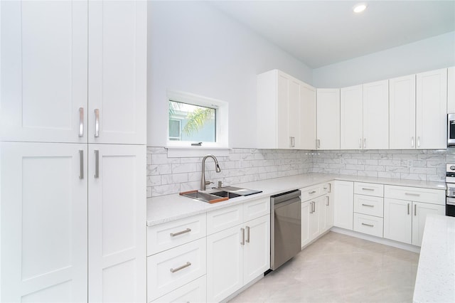 482 Sunset Rd N, Rotonda West, FL 33947 - kitchen featuring stainless steel appliances, a sink, tasteful backsplash, white cabinetry, and recessed lighting