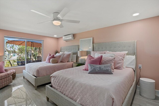 7530 Whitcomb St, Englewood, FL 34223 - bedroom with a wall mounted AC, baseboards, light wood-style floors, and recessed lighting