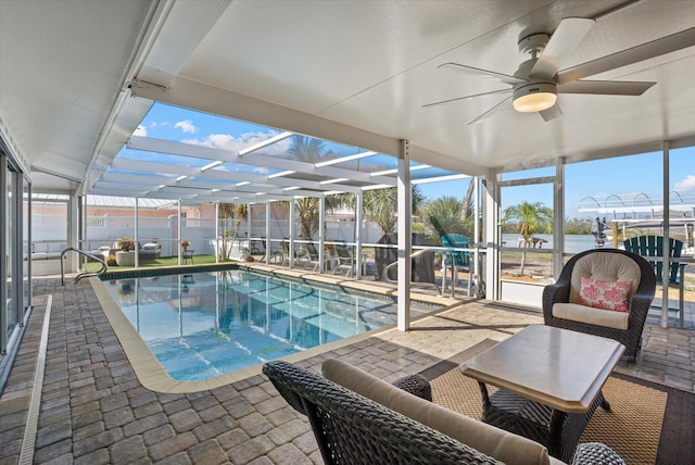 7530 Whitcomb St, Englewood, FL 34223 - view of swimming pool featuring a patio, a lanai, ceiling fan, and a fenced backyard