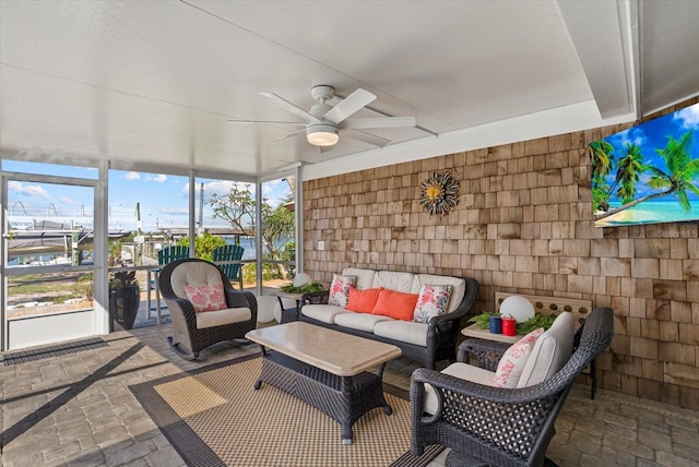 7530 Whitcomb St, Englewood, FL 34223 - sunroom featuring a ceiling fan and an outdoor hangout area
