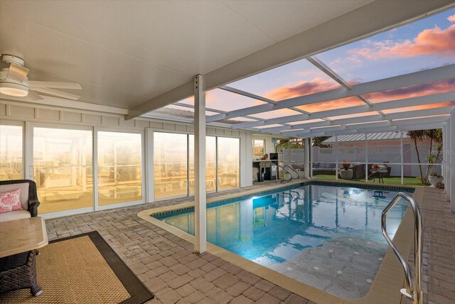 7530 Whitcomb St, Englewood, FL 34223 - view of swimming pool with a pool, a patio, glass enclosure, and ceiling fan