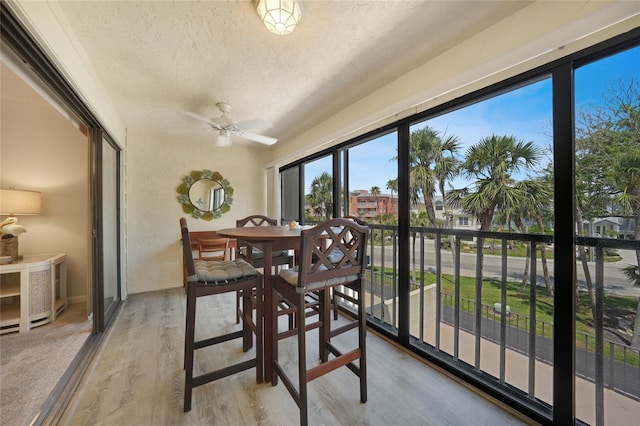1501 Beach Rd Unit 310, Englewood, FL 34223 - sunroom with a textured ceiling and wood finished floors