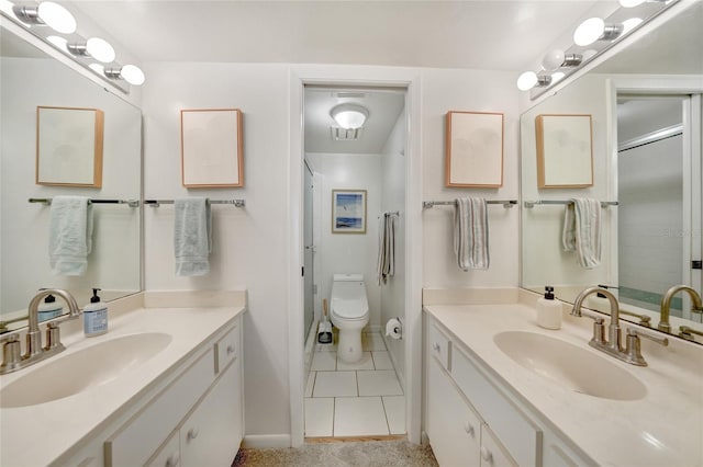 1501 Beach Rd Unit 310, Englewood, FL 34223 - bathroom featuring vanity, tile patterned floors, a shower, baseboards, and toilet