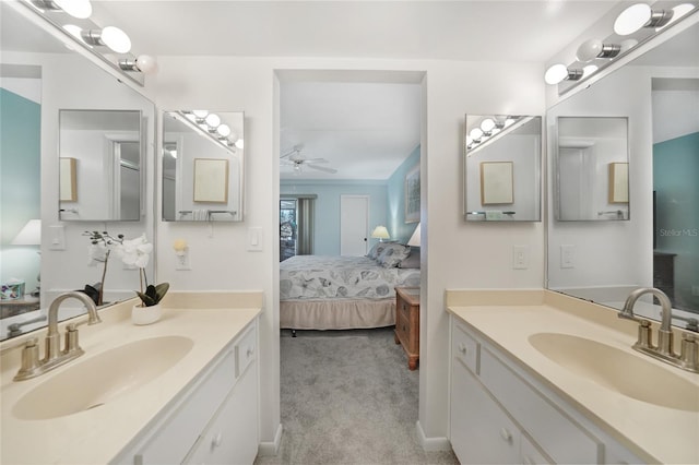 1501 Beach Rd Unit 310, Englewood, FL 34223 - bathroom featuring ensuite bath, ceiling fan, and two vanities