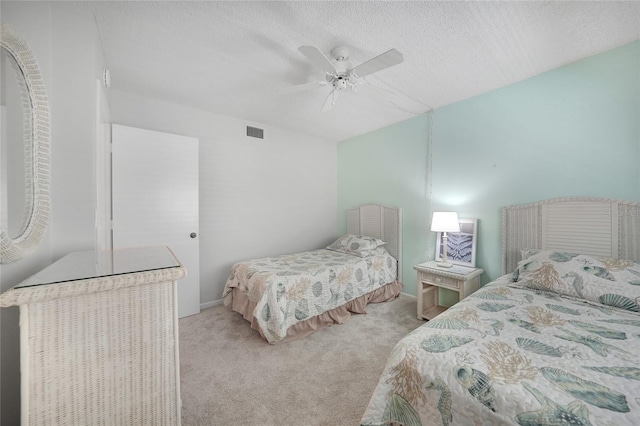 1501 Beach Rd Unit 310, Englewood, FL 34223 - bedroom featuring carpet flooring, a textured ceiling, and ceiling fan