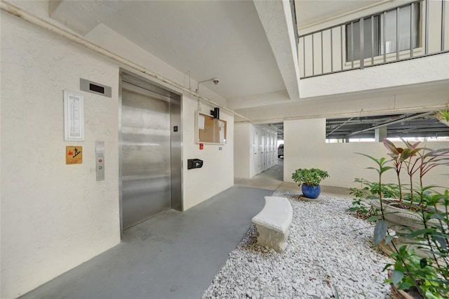 1501 Beach Rd Unit 310, Englewood, FL 34223 - entrance to property featuring elevator and stucco siding