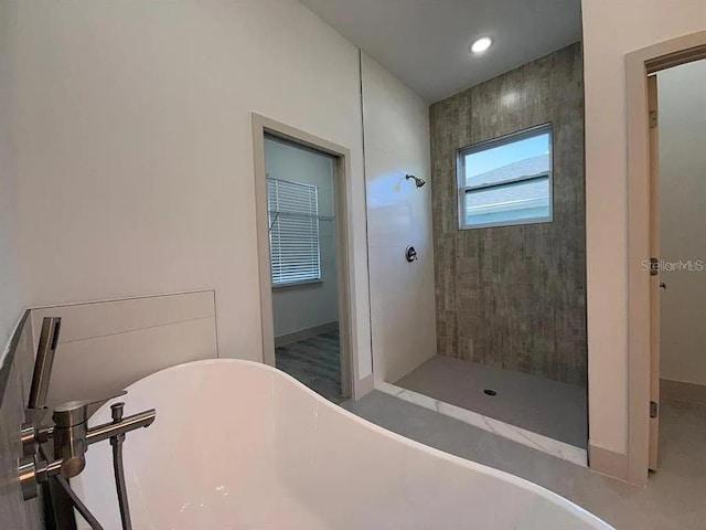 311 Yule St, Port Charlotte, FL 33953 - bathroom with tiled shower, a freestanding bath, baseboards, and recessed lighting