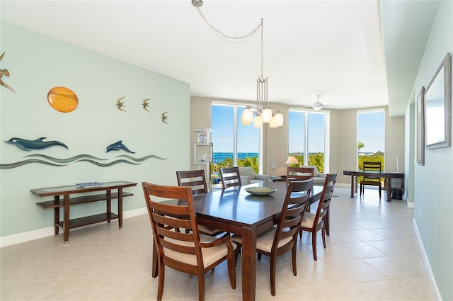 1375 Beach Rd Unit 201, Englewood, FL 34223 - dining area featuring a ceiling fan, light tile patterned flooring, and baseboards