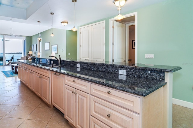 1375 Beach Rd Unit 201, Englewood, FL 34223 - kitchen with a sink, light tile patterned floors, light brown cabinetry, and hanging light fixtures