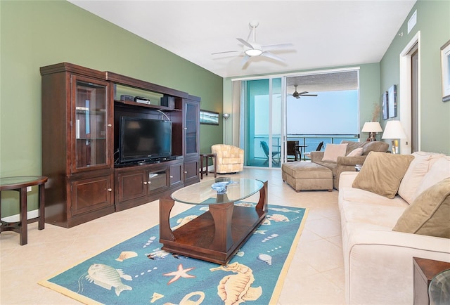 1375 Beach Rd Unit 201, Englewood, FL 34223 - living area with ceiling fan, tile patterned floors, and expansive windows