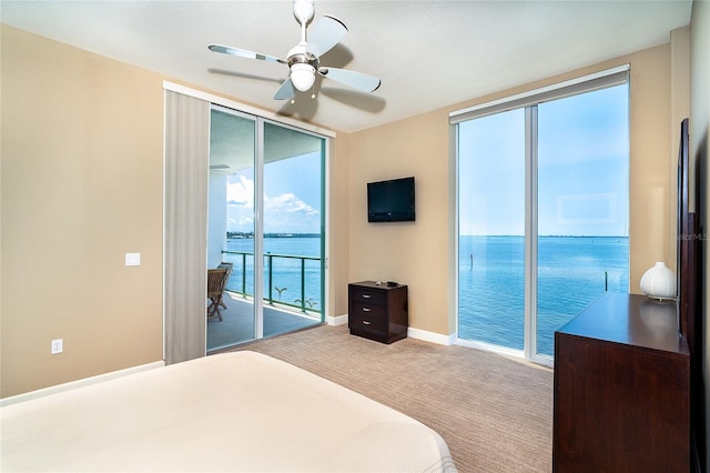 1375 Beach Rd Unit 201, Englewood, FL 34223 - carpeted bedroom featuring access to exterior, baseboards, a ceiling fan, and floor to ceiling windows
