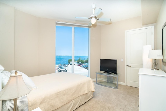 1375 Beach Rd Unit 201, Englewood, FL 34223 - bedroom with light colored carpet, baseboards, and ceiling fan