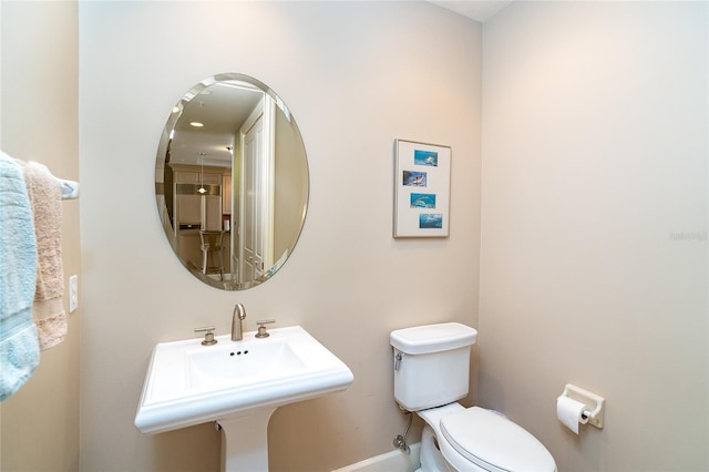 1375 Beach Rd Unit 201, Englewood, FL 34223 - bathroom featuring toilet and baseboards