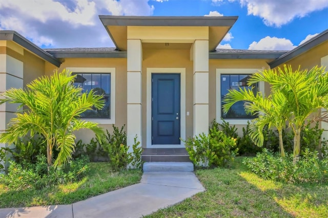 10242 Hallendale Dr, Port Charlotte, FL 33981 - doorway to property featuring stucco siding