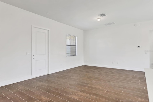 10242 Hallendale Dr, Port Charlotte, FL 33981 - unfurnished room with dark wood-type flooring and baseboards