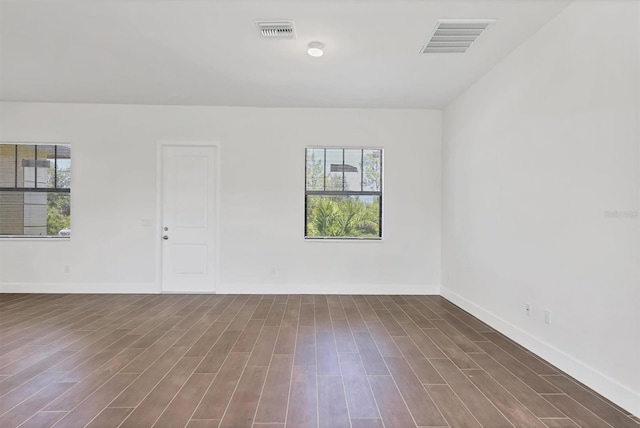 10242 Hallendale Dr, Port Charlotte, FL 33981 - spare room with dark wood finished floors and baseboards
